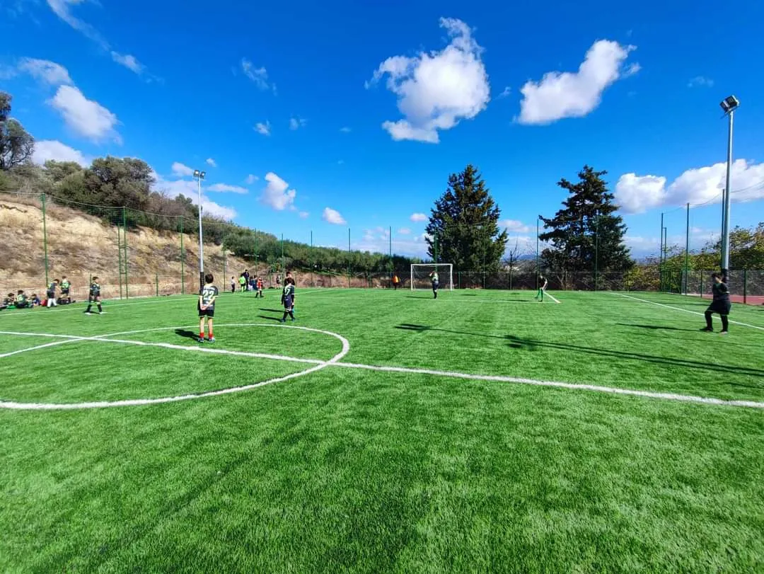 Football match on the turf pitch at Evgeniki Stadium