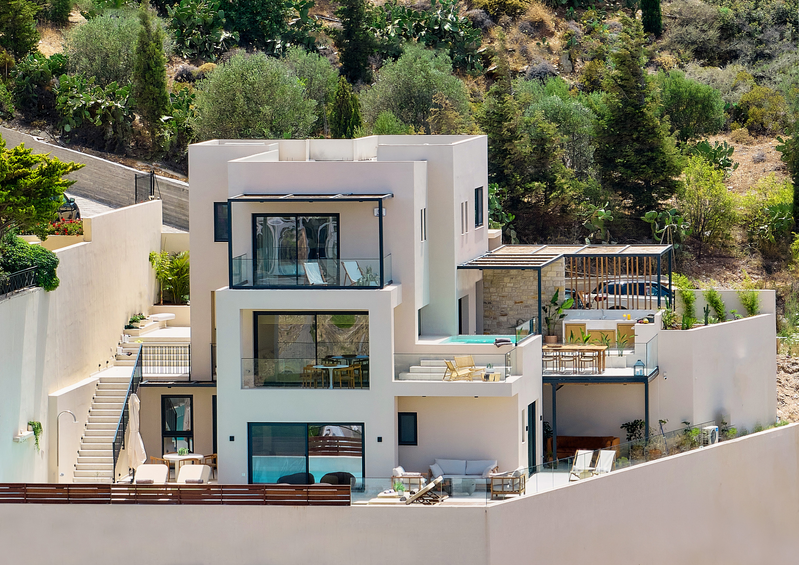 The Nook Villa — front elevation with three stepped volumes, Crete