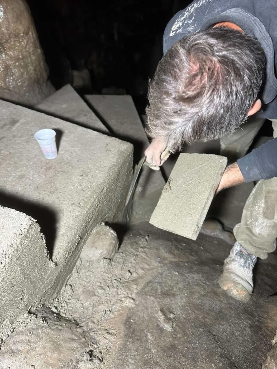 Finished concrete step sections in the cave interior
