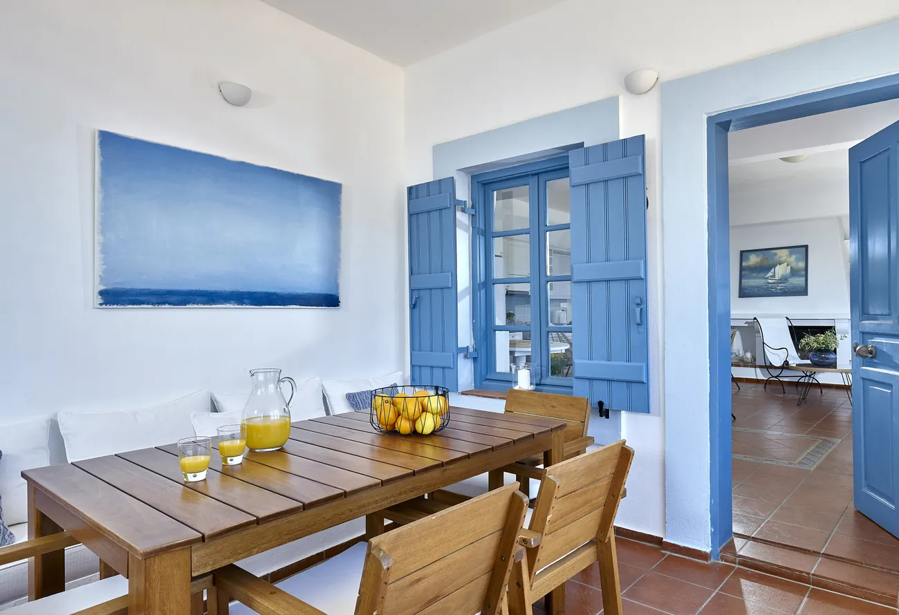 Turquoise interior doors and dining area of Naya