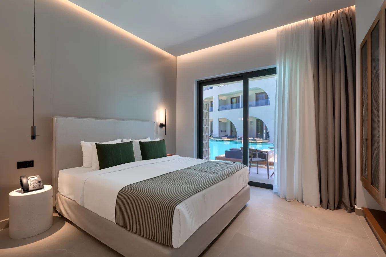 Suite interior with pool view at the Dore Hotel new building