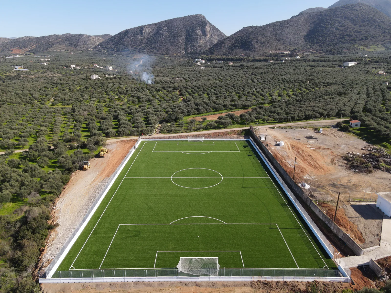 Aerial view of the Sisi pitch with the mountains of Lasithi behind