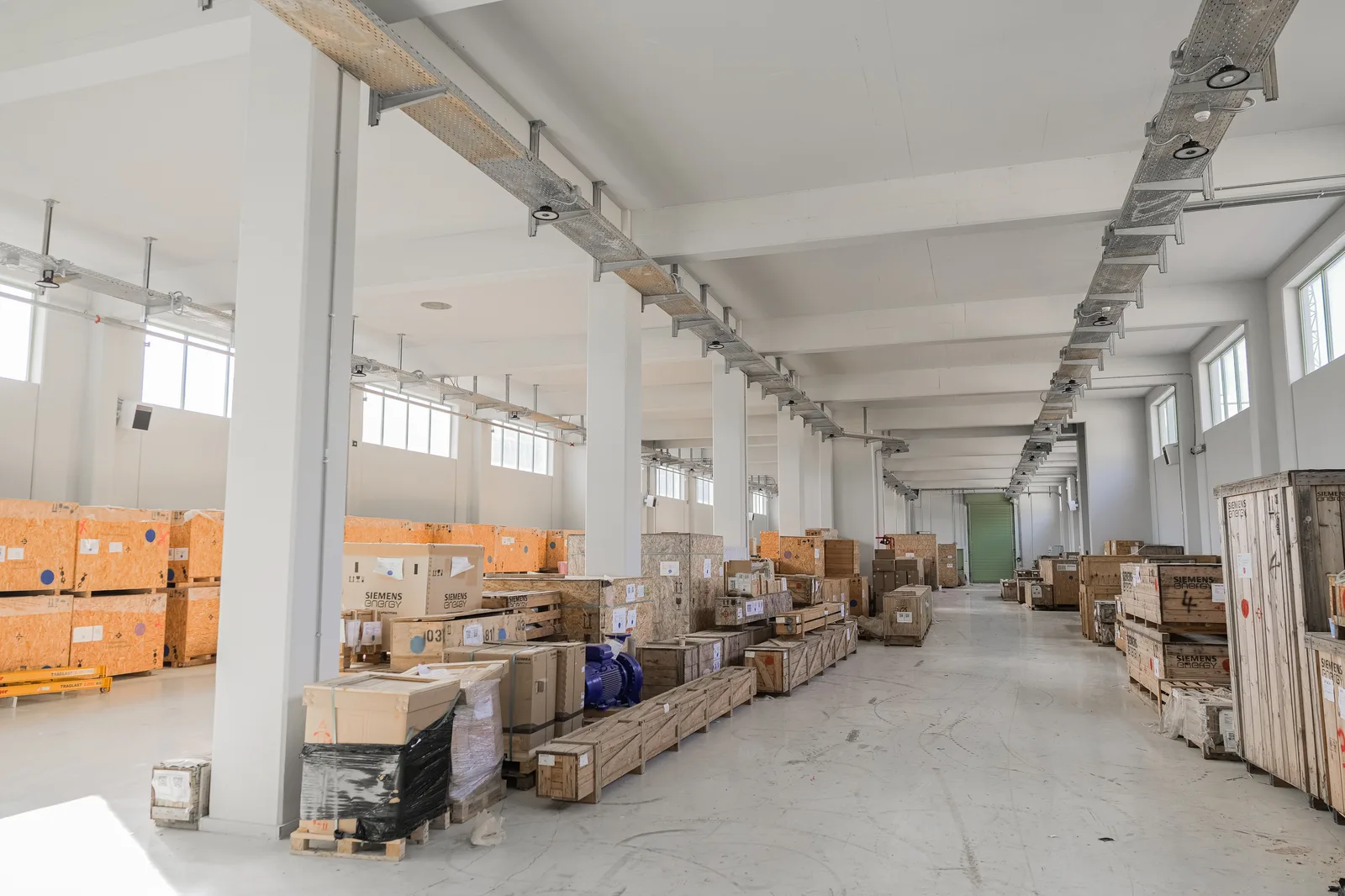 Warehouse interior with equipment crates during fit-out