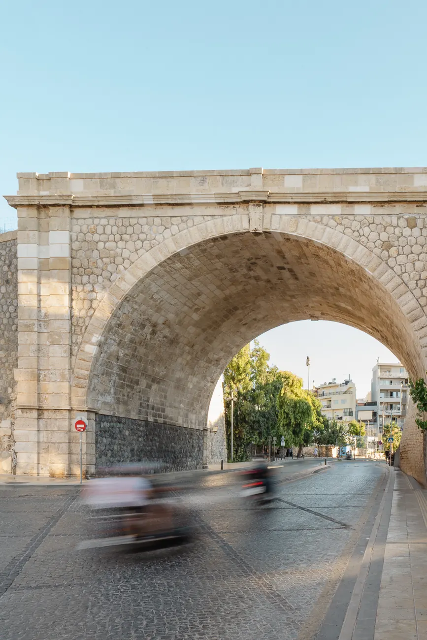 The Chanioporta arch over the road, with traffic passing beneath it