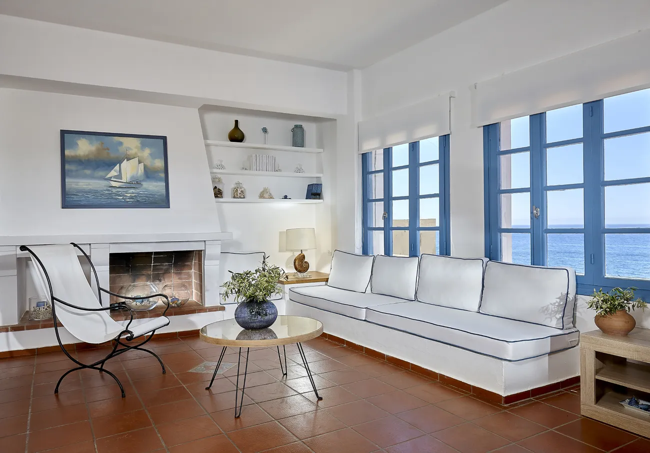 Lounge of Naya with fireplace, in the seafront property renovated by Lydakis Construction