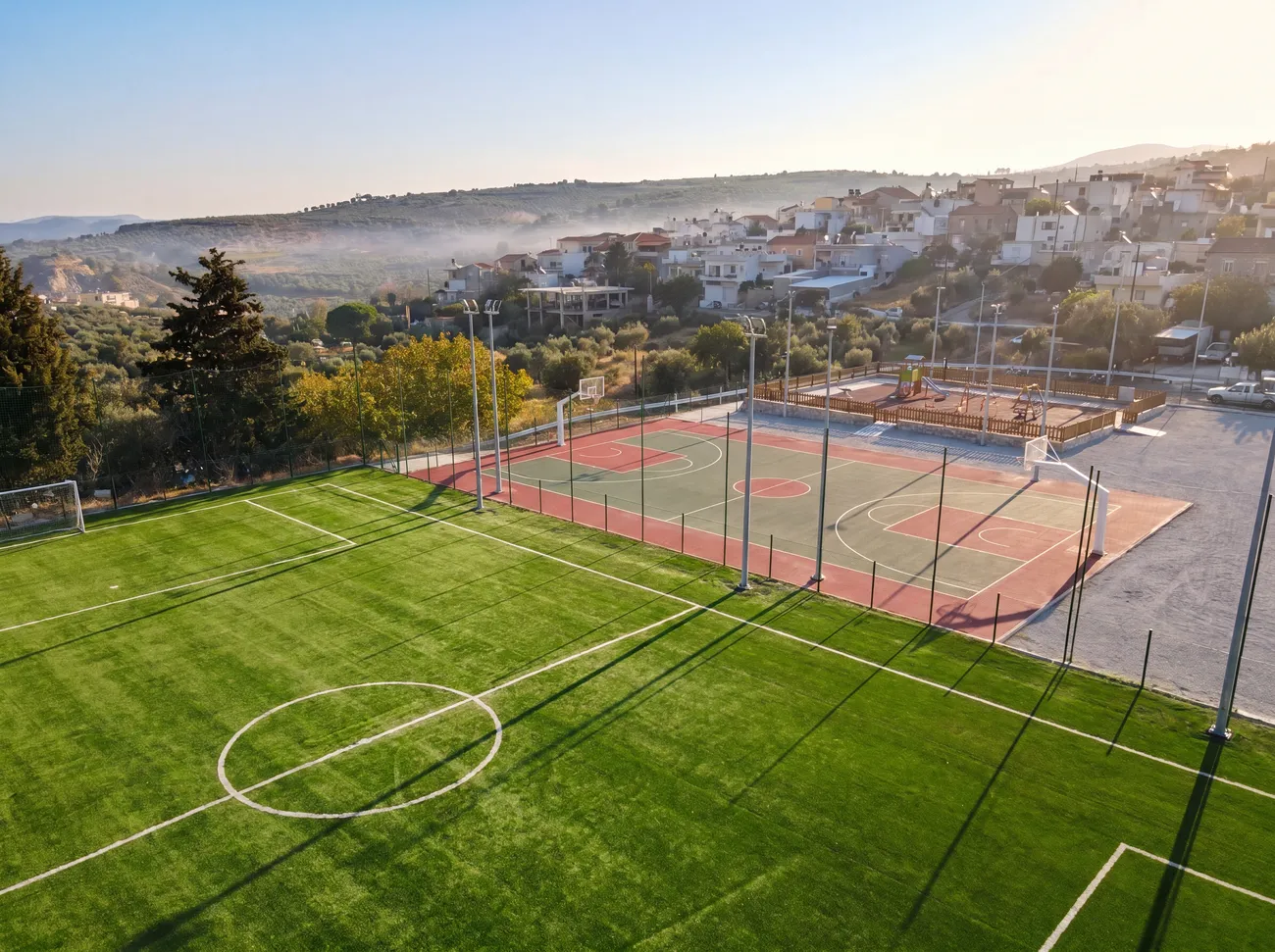 Aerial view of the Evgeniki Stadium football pitch and courts