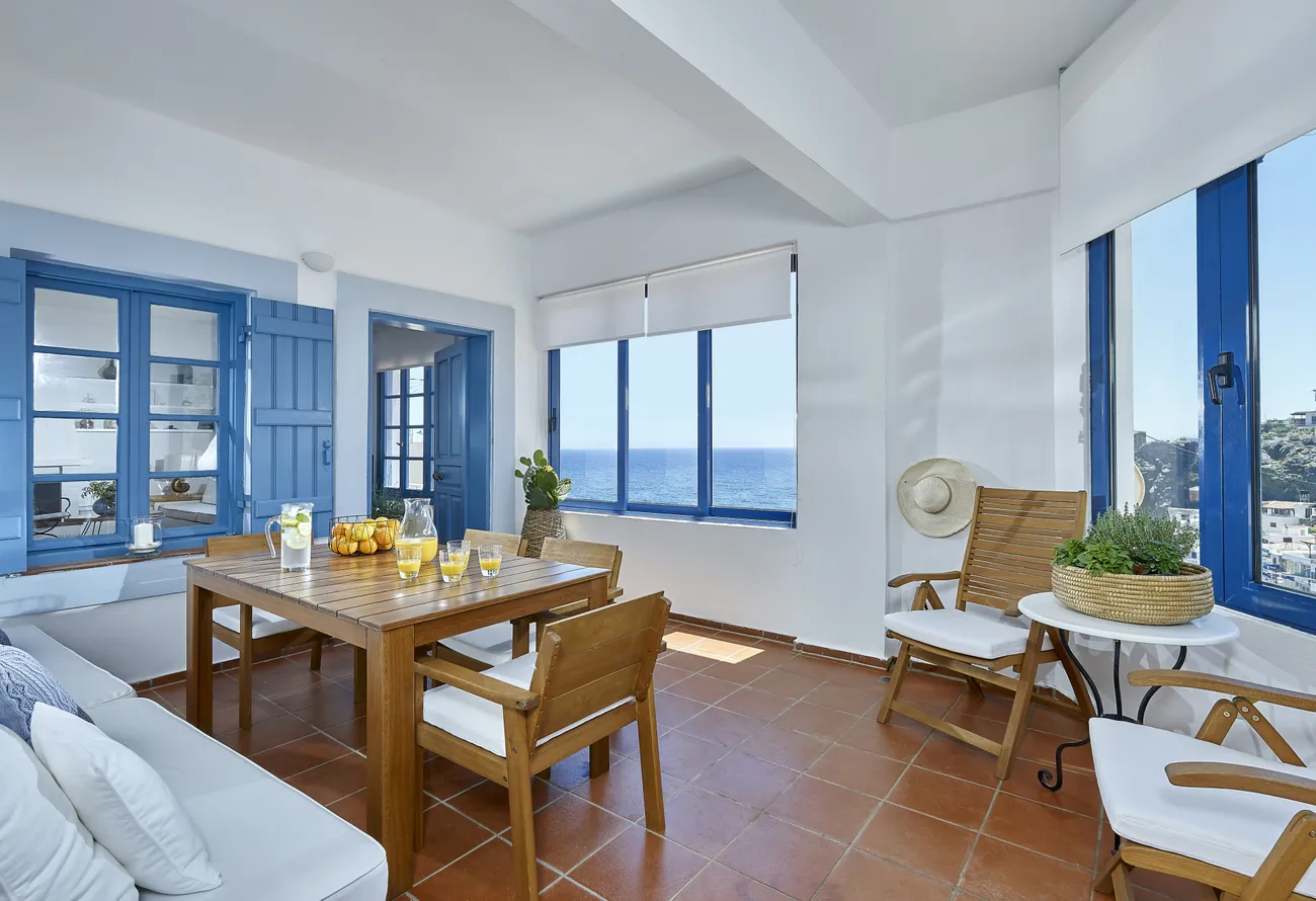 Sitting corner of Naya with wicker chairs and sea views