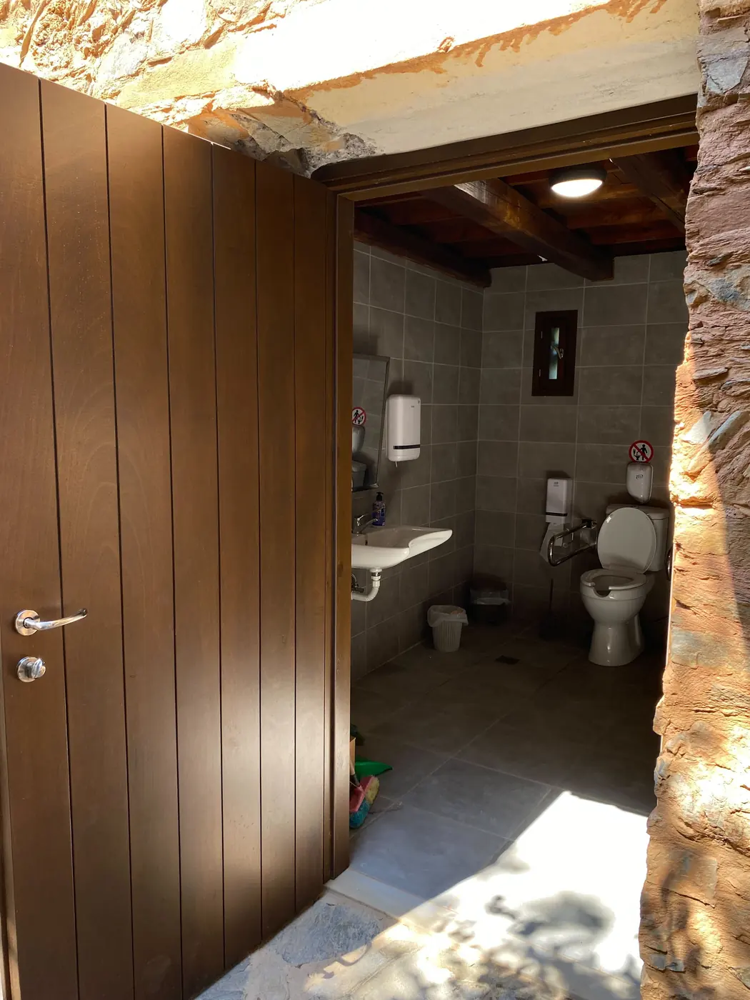 Rebuilt washroom with grab rails and accessible fittings
