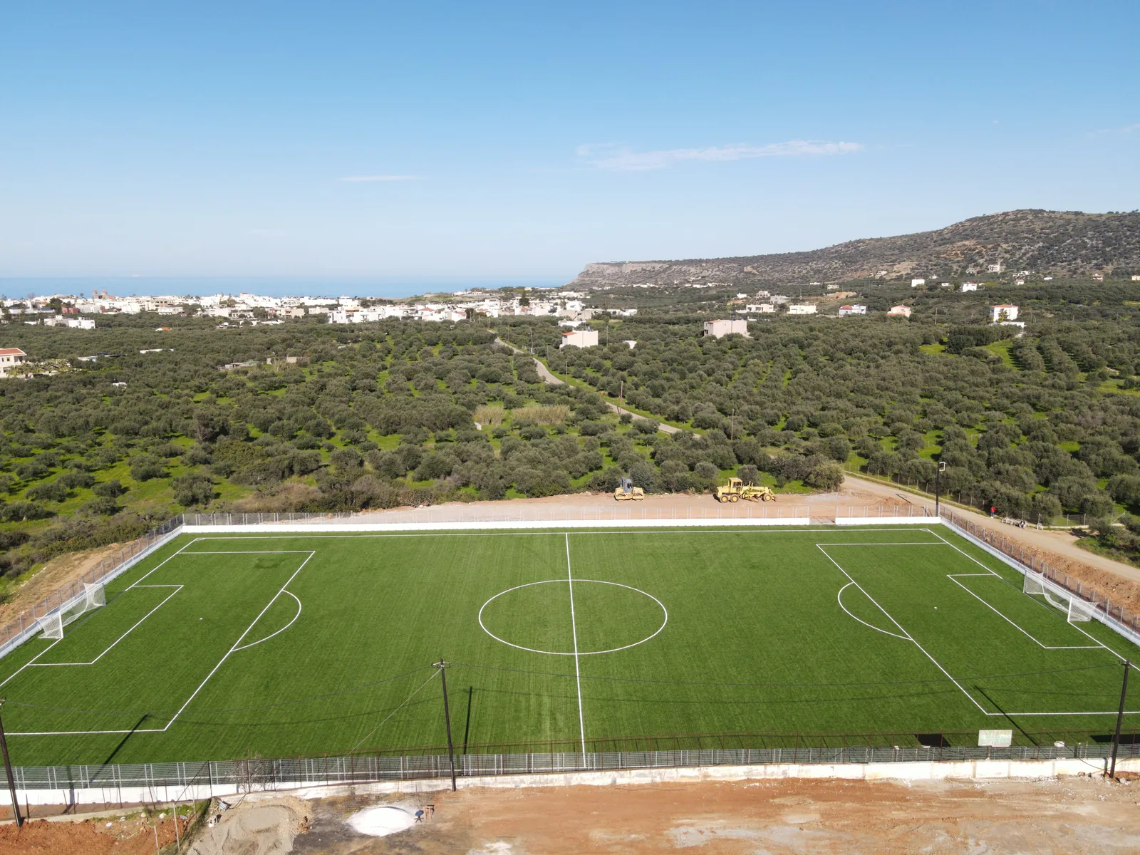 Elevated view along the Sisi pitch towards the sea and the village