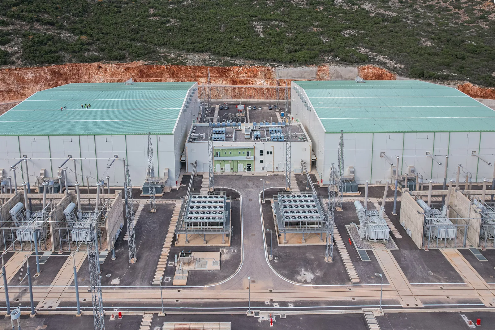 The twin converter halls and transformer bays of the Damasta HVDC station from the air