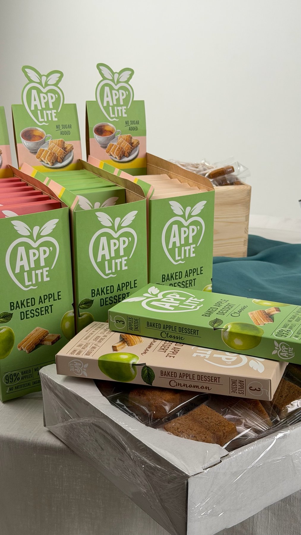Retail cases of App'Lite Apple Bars stacked for a wholesale delivery
