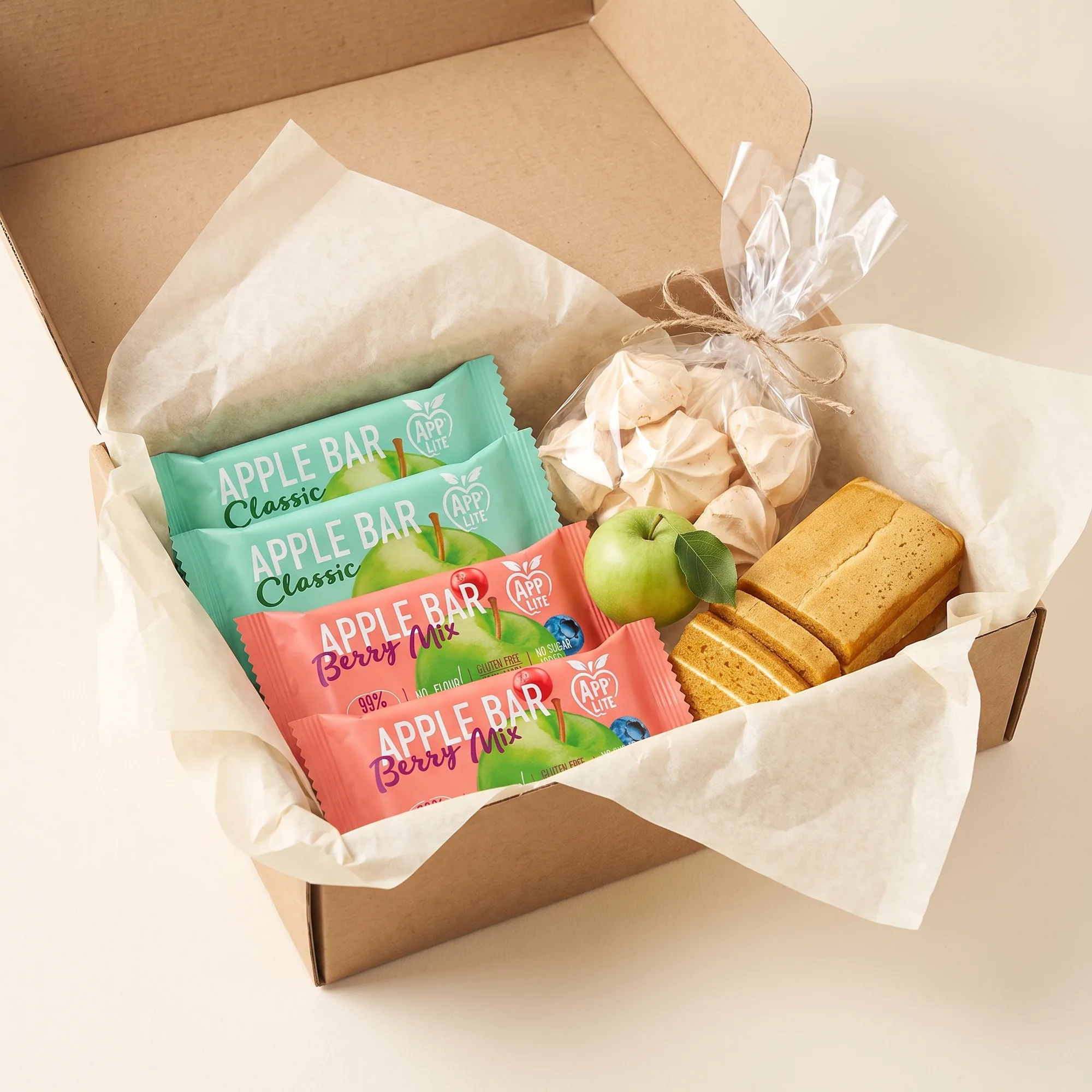 Open kraft gift box with Apple Bars, meringues and sliced pastila