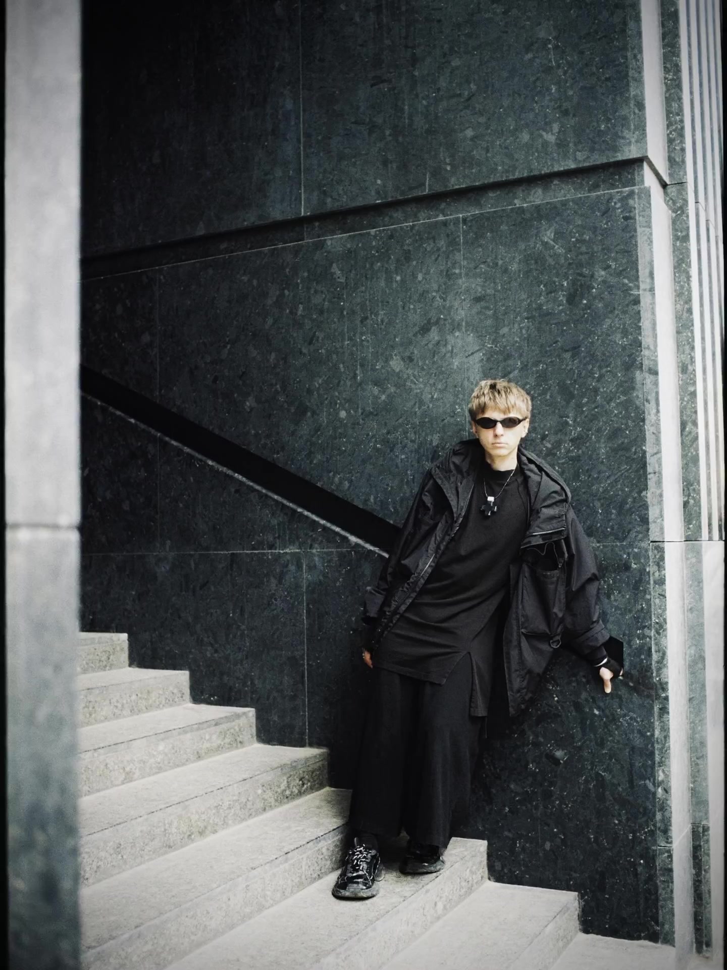 Dima Smolin standing on a stone staircase