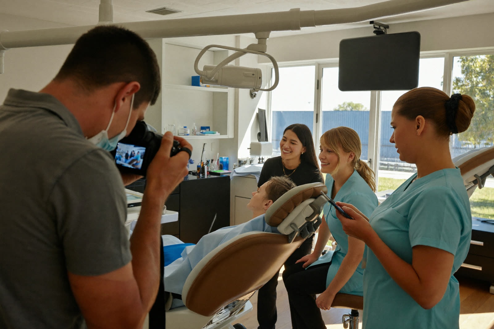A photographer shooting a smiling dental team in a bright practice