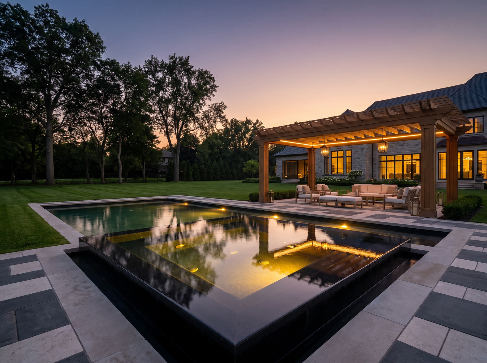 Backyard and pool of a luxury GTA estate at dusk