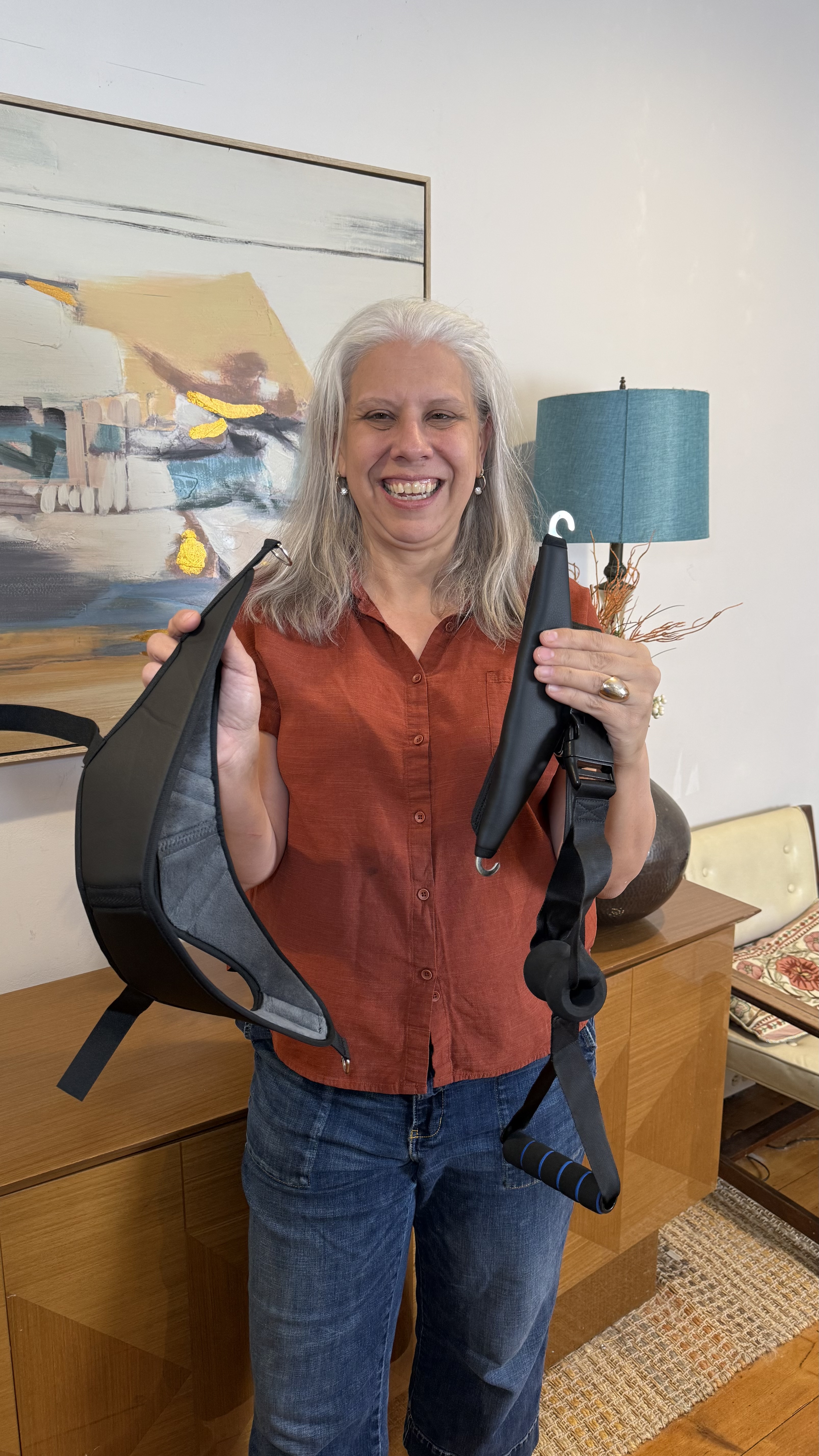 Holding the real BlisCure device, showing the wide padded contact area