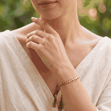The Tibetan Copper Shield Bracelet worn on the wrist
