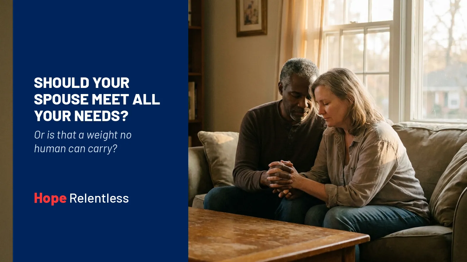 Interracial couple in their 40s sitting close with hands clasped in prayer, showing God as the source no spouse can replace