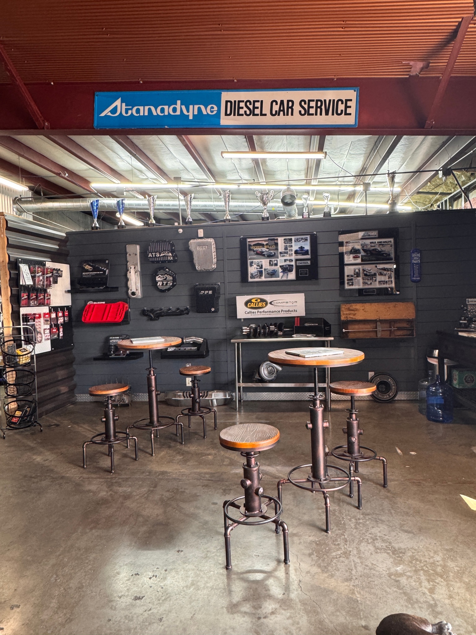 G & J Diesel service area with performance parts on display