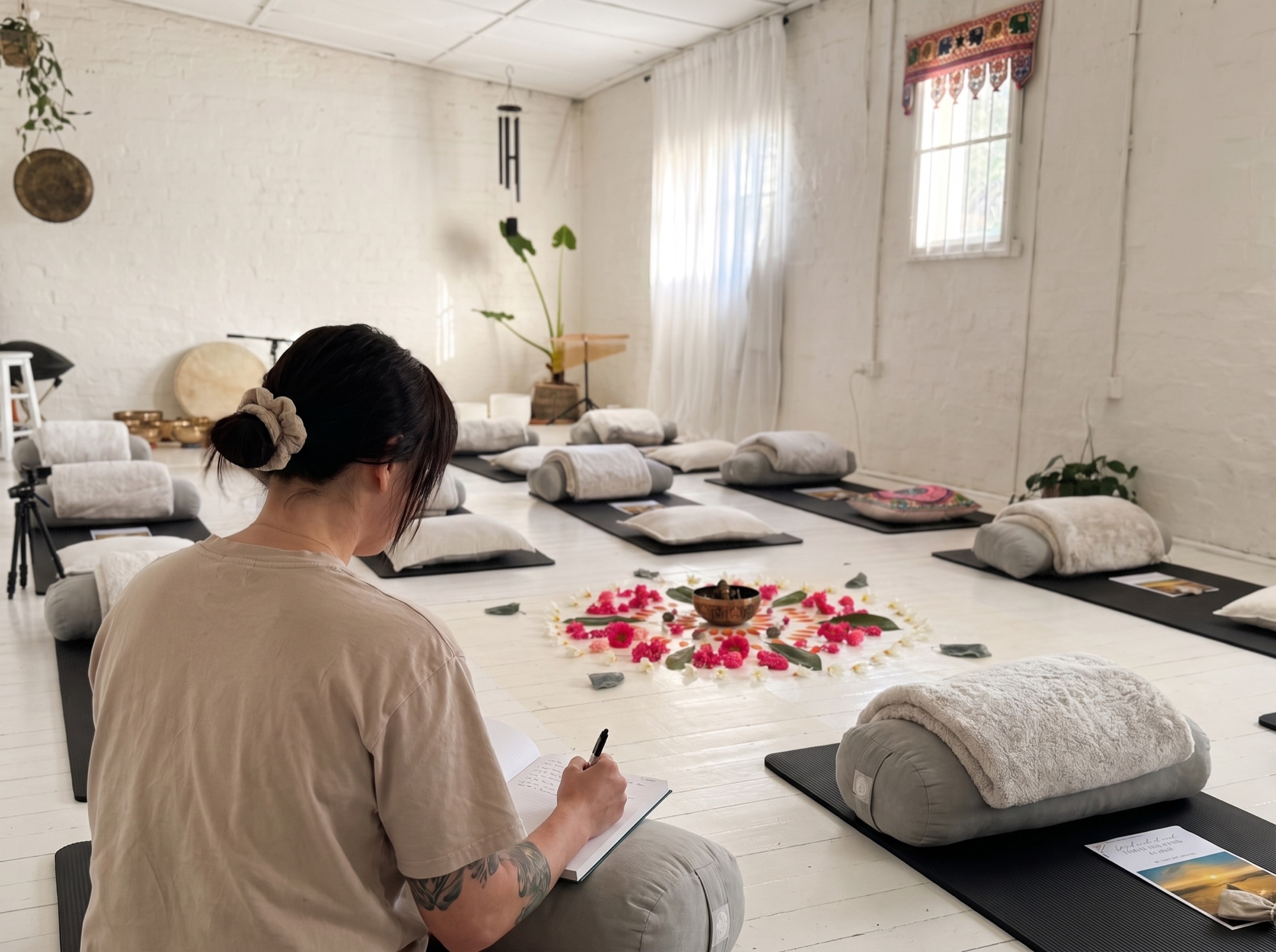 The studio set for the Spring Energy Cleanse, mats around a flower mandala