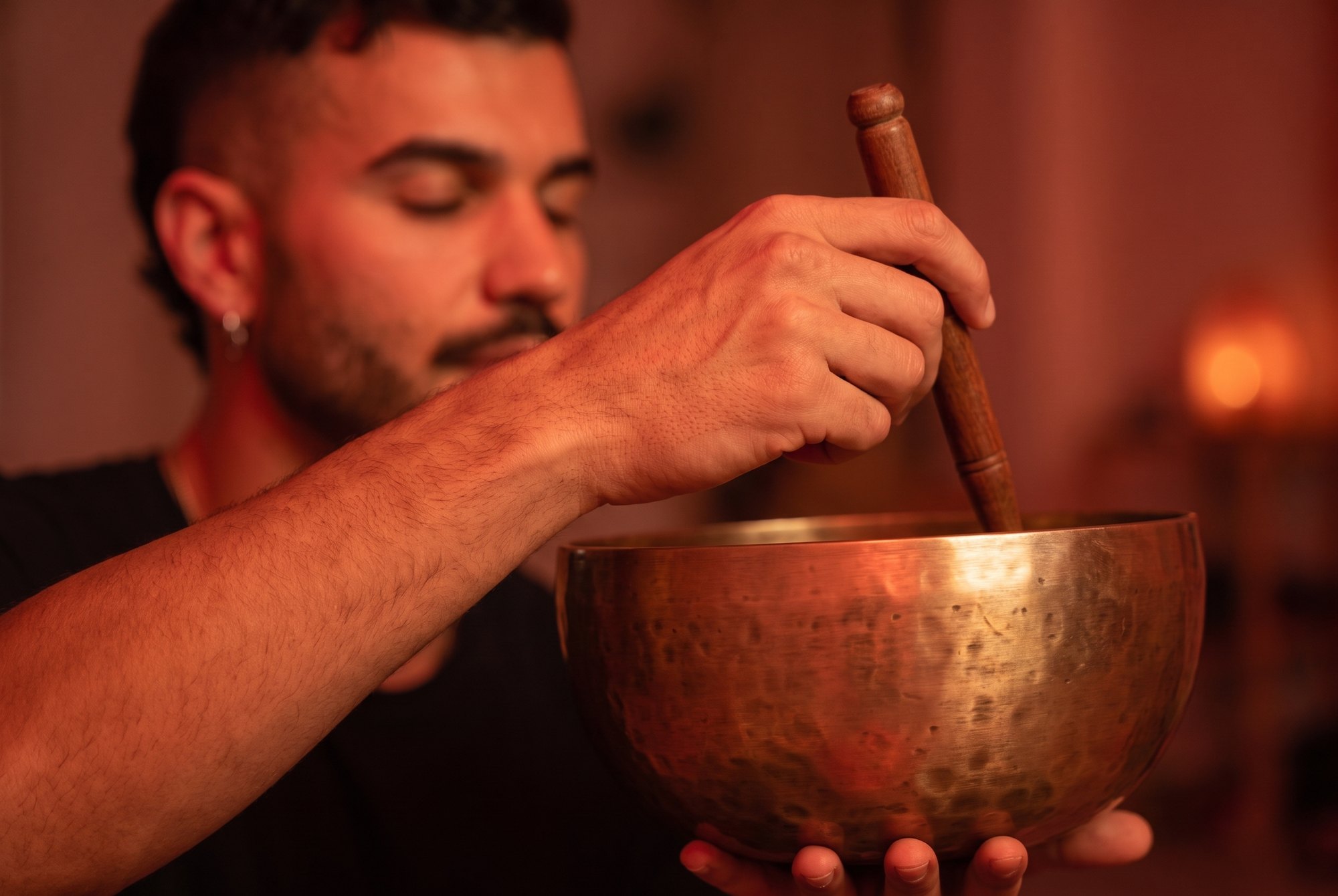 Ange playing a Tibetan singing bowl at Sound of Soma