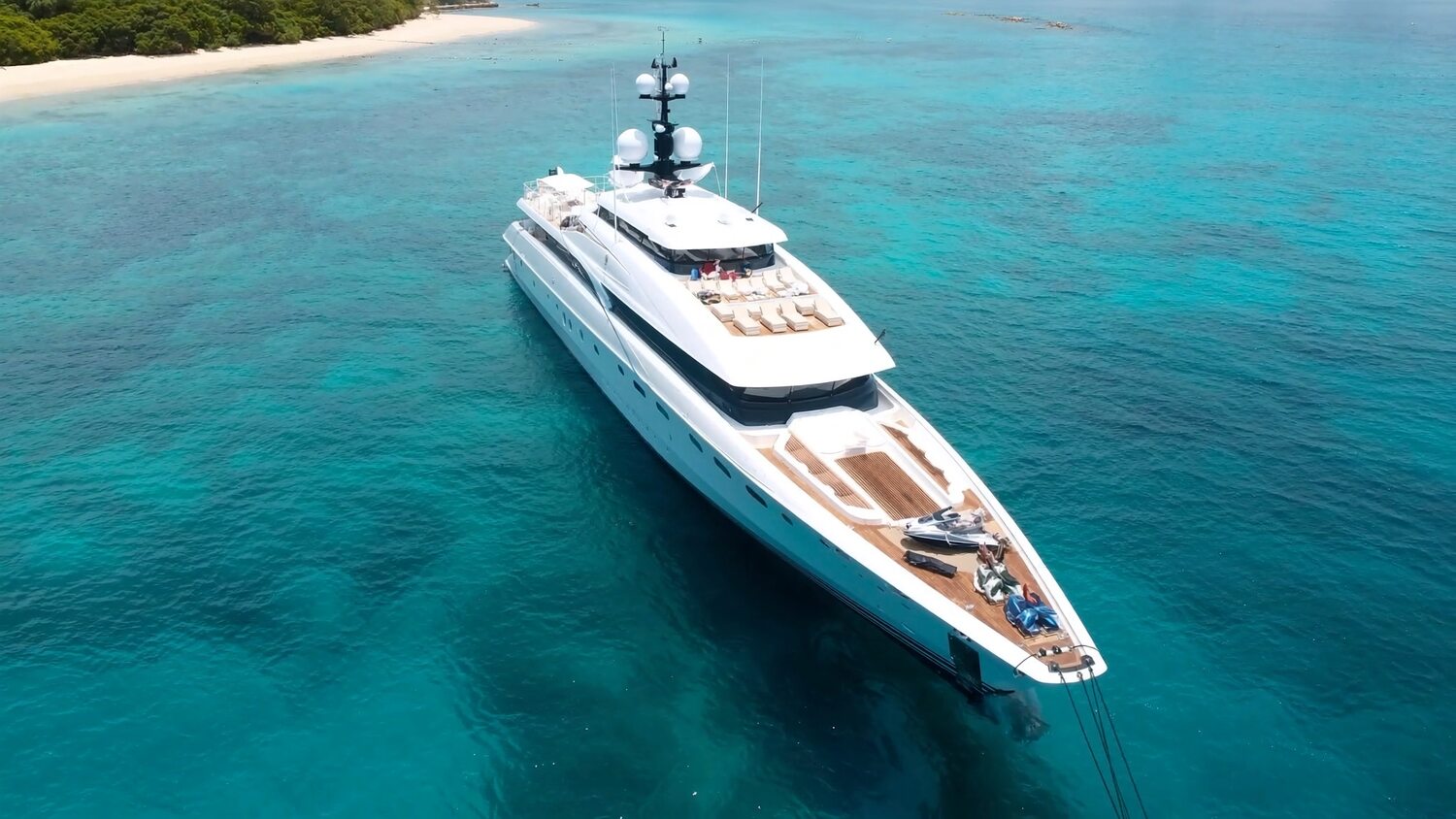 Aerial view of an Azure Yachts superyacht in a turquoise bay