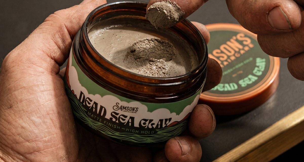 The honest matte grey-brown texture of Samson's Dead Sea Clay inside the open jar