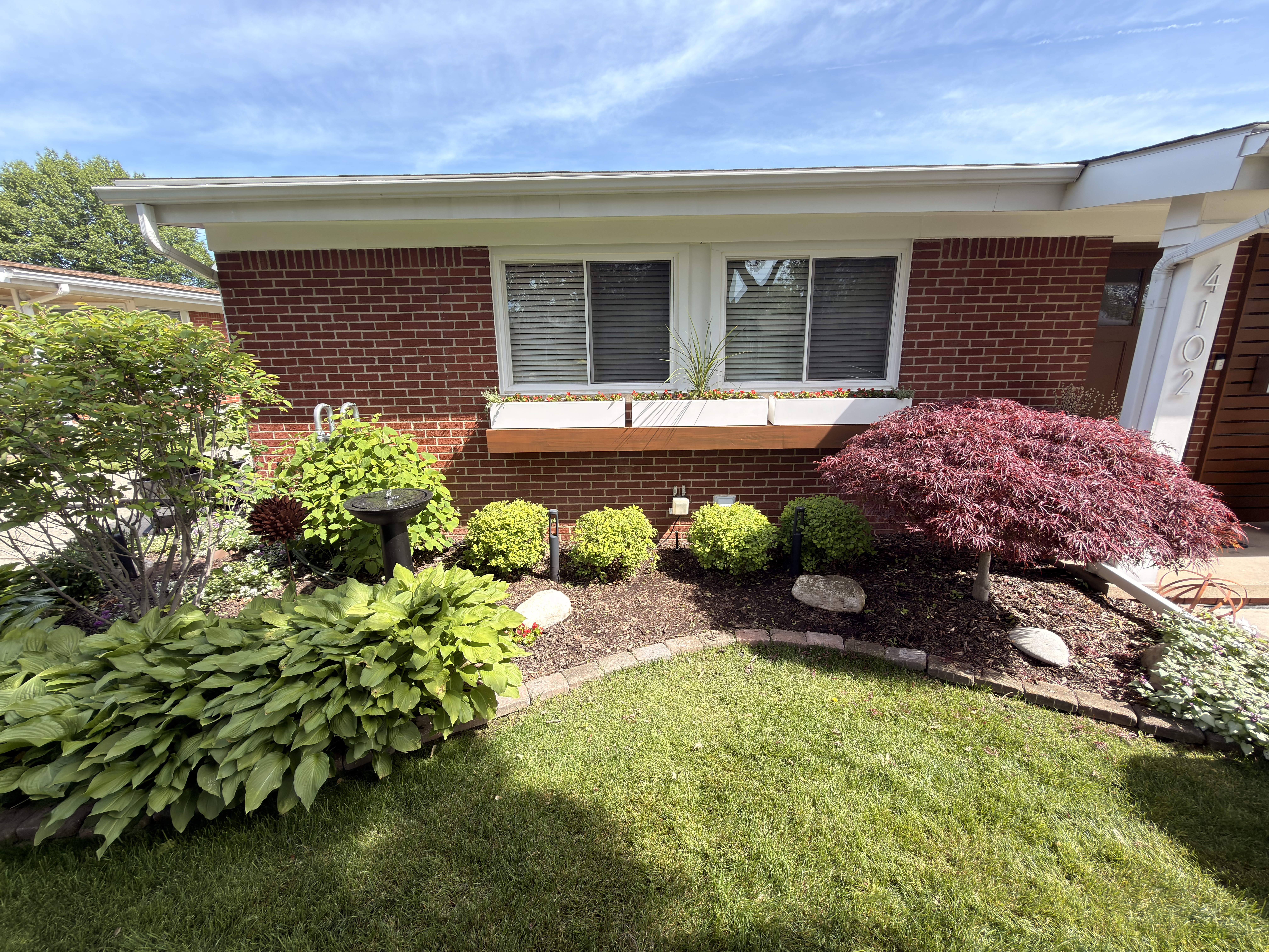 Before and after front yard landscape transformation by SB Outdoor Solutions