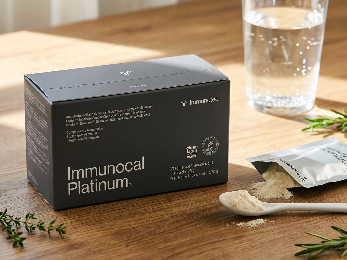 Immunocal Platinum sachets and box on a wooden countertop