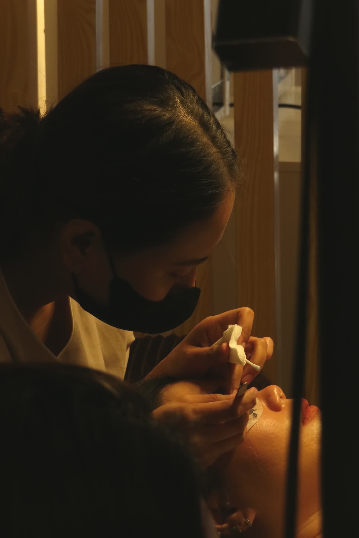 Lash artist working on a real client at Serené Beauté Studio — lash extensions Denpasar