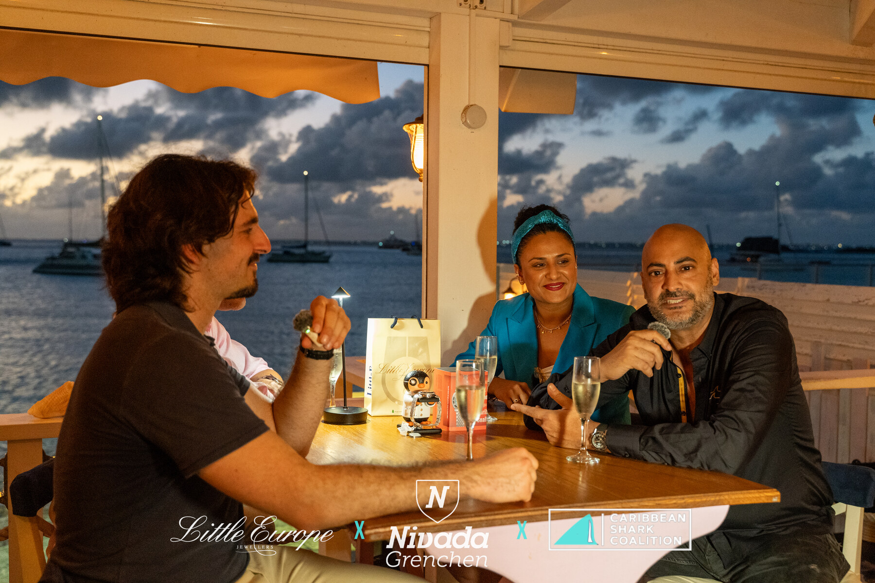 Guests at the table as the sun sets over Grand Case