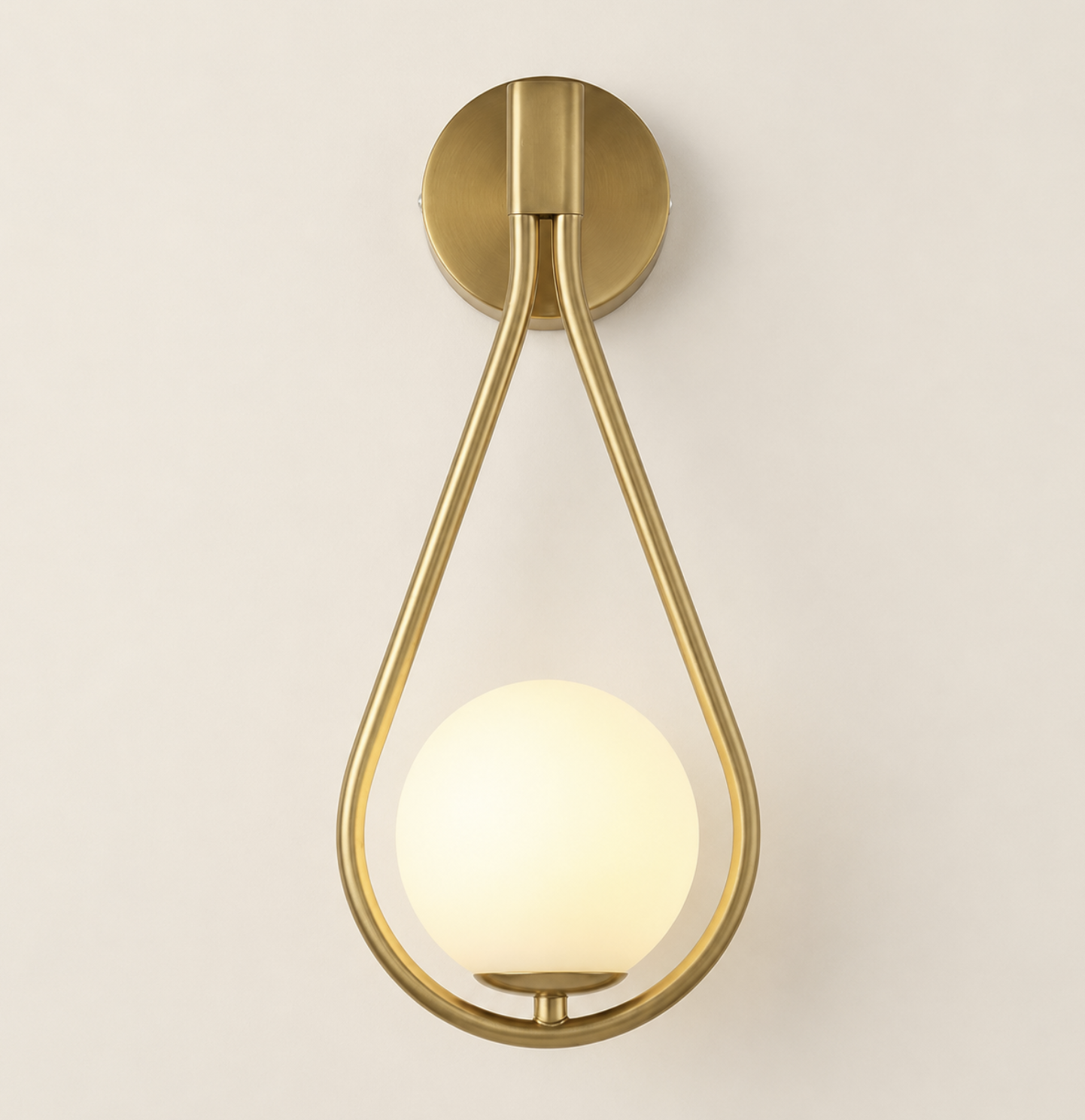 Brass teardrop loop wall sconce with frosted globe