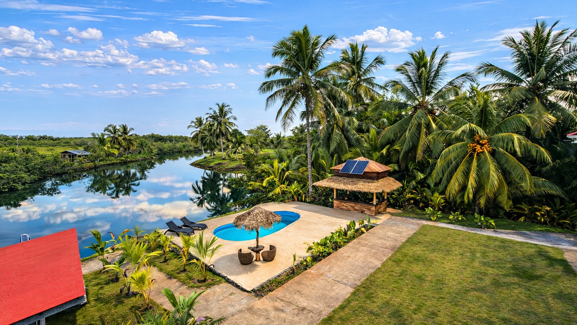 The swimming pool and thatched palapa from above