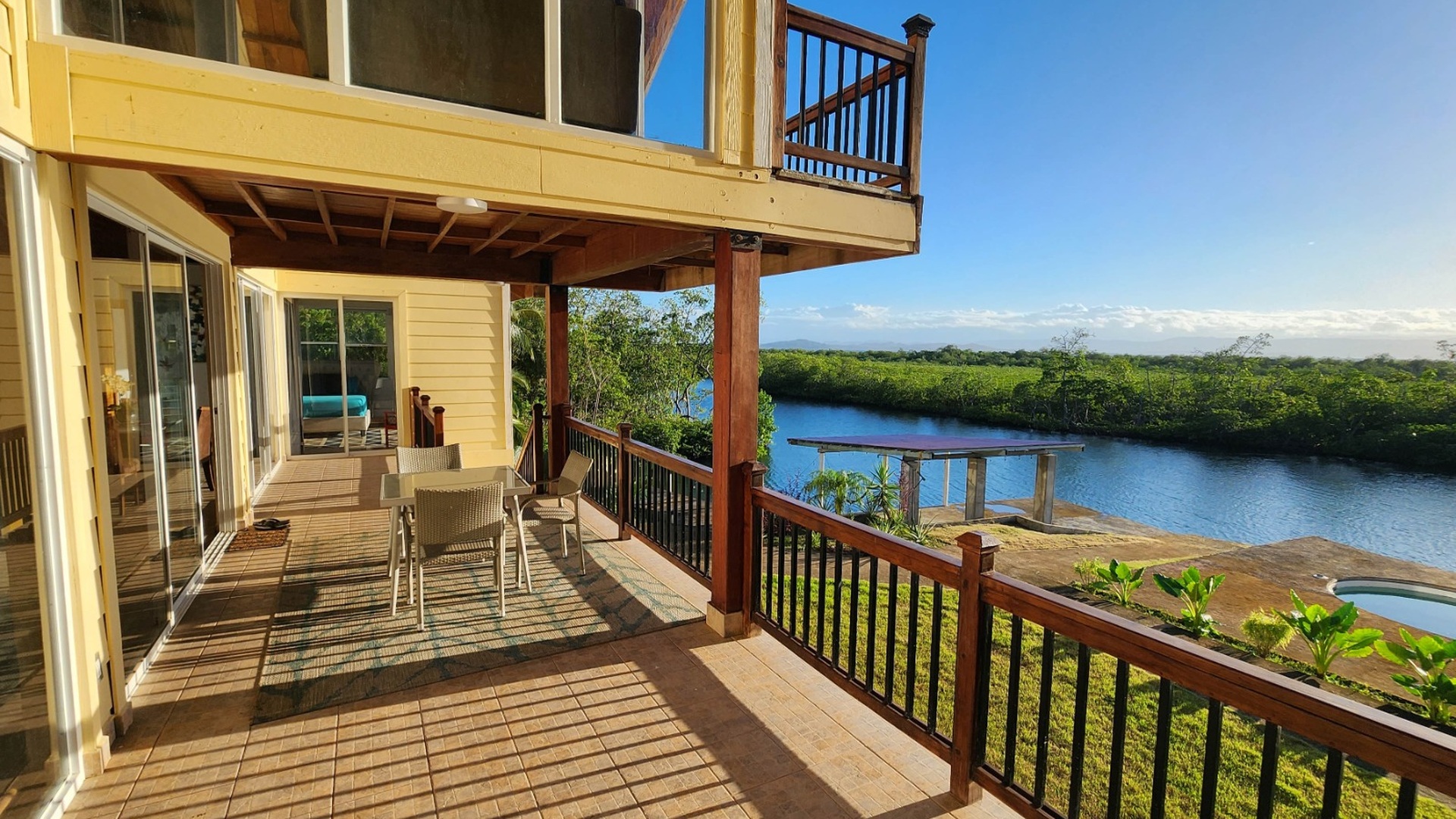 The covered veranda looking out over the canal and mangroves