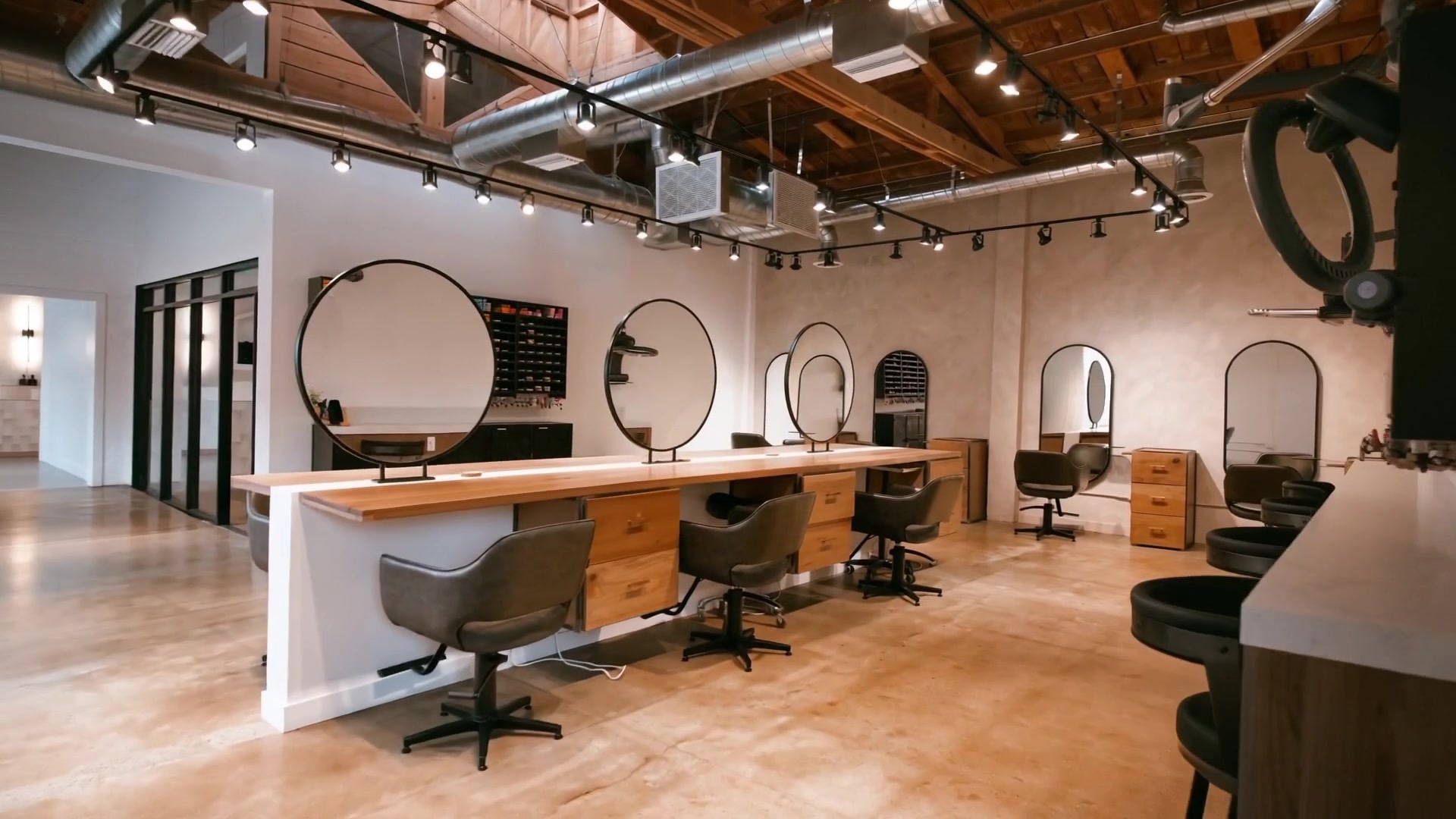 Inside AGENCÉ Salon — styling stations and mirrors