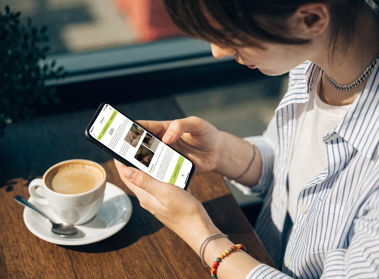 Person using a laptop to review a mobile-friendly website layout