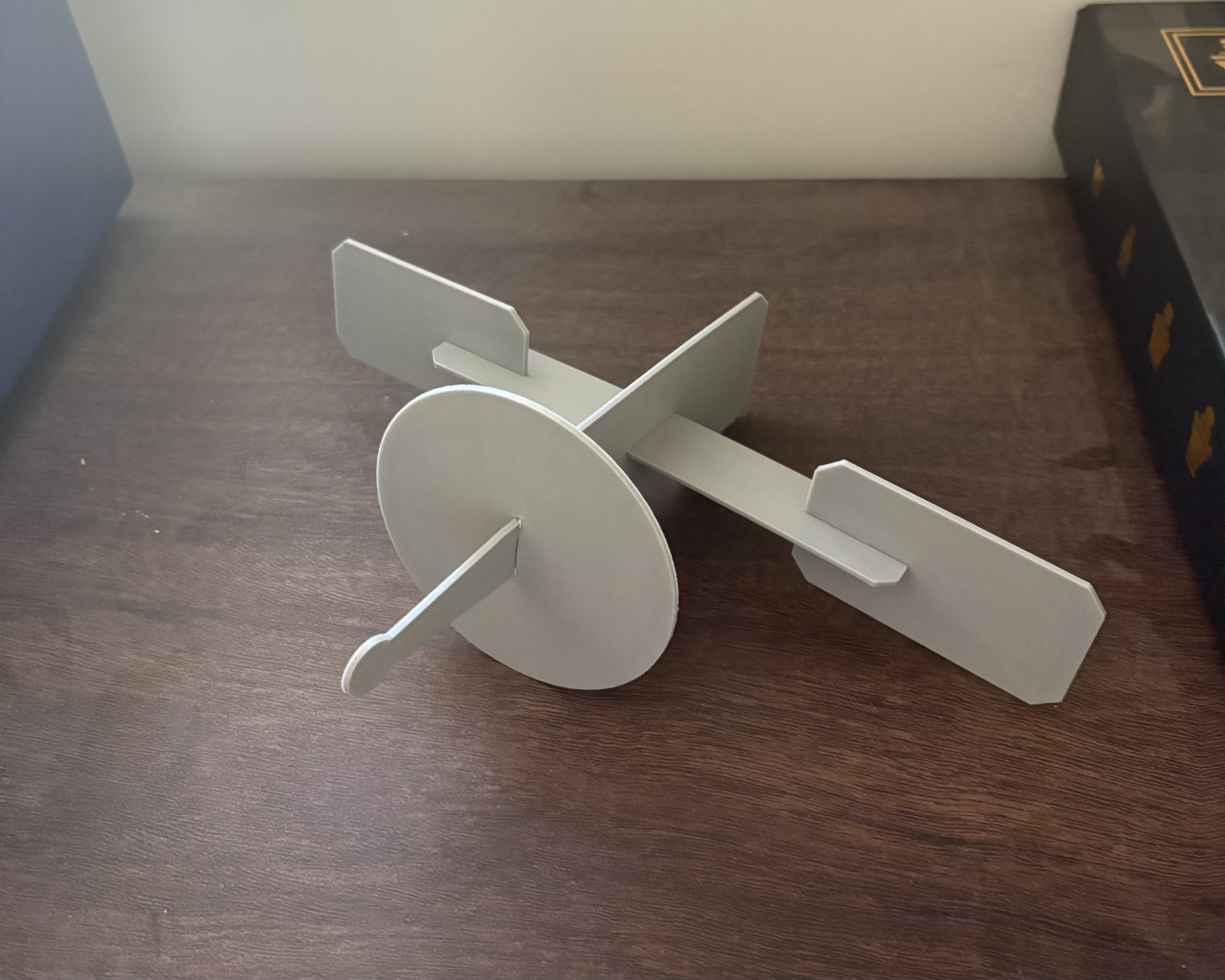 Screen-free STEM satellite project with dish and solar panel wing built from cardboard