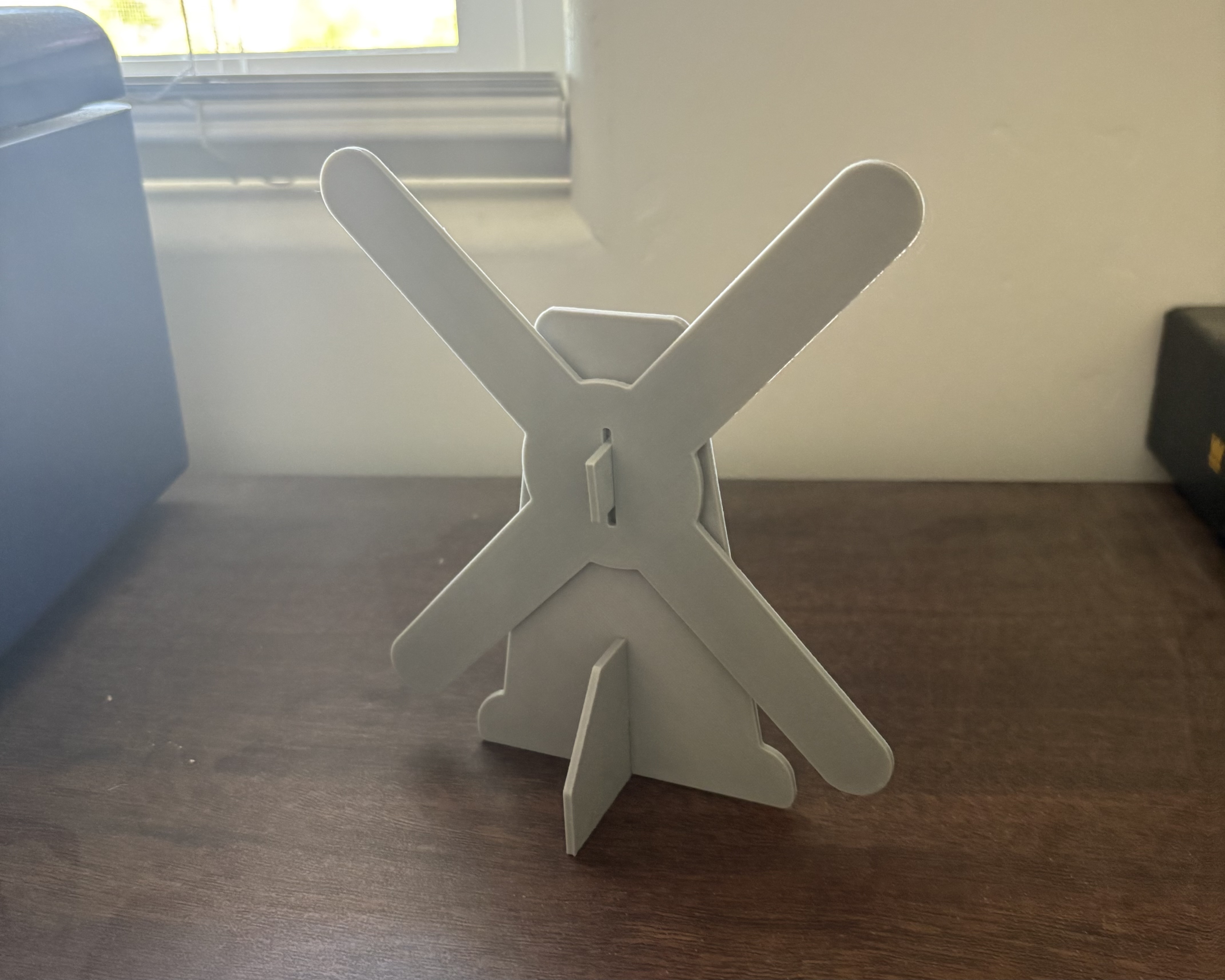 Screen-free STEM windmill project with spinning blades built from cage cardboard