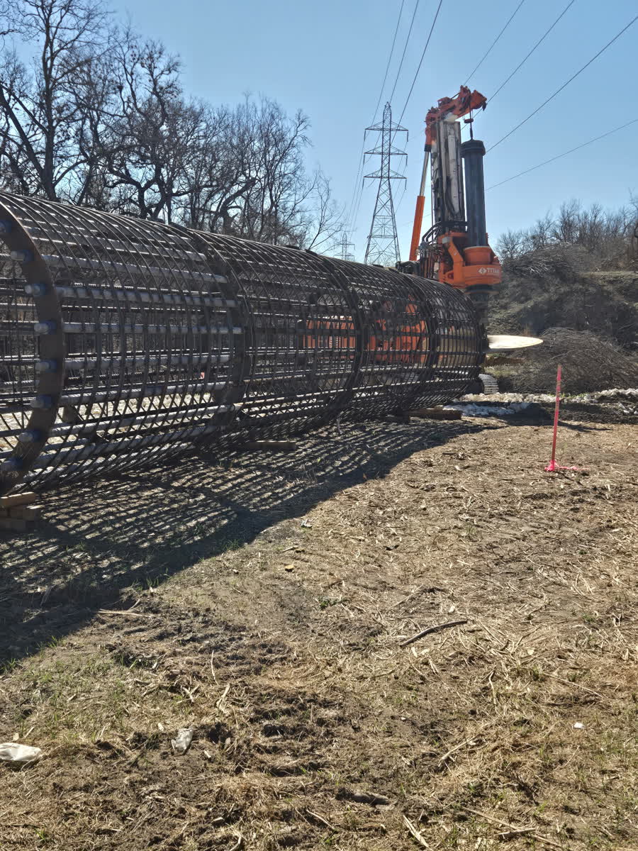 Rebar cages laid out in the field ahead of setting