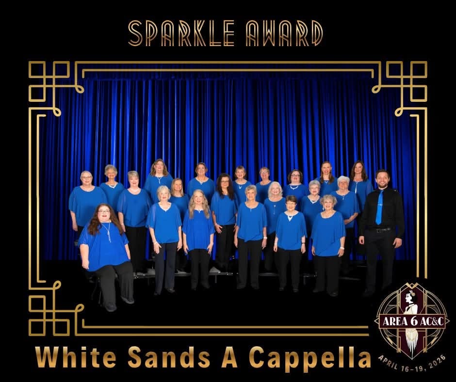 The Area 6 Sparkle Award artwork showing the White Sands A Cappella chorus on stage in blue