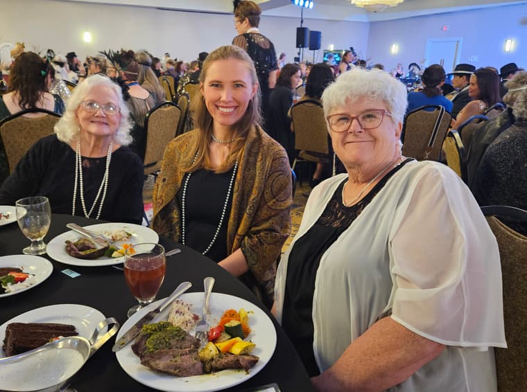 Three members at a convention dinner table
