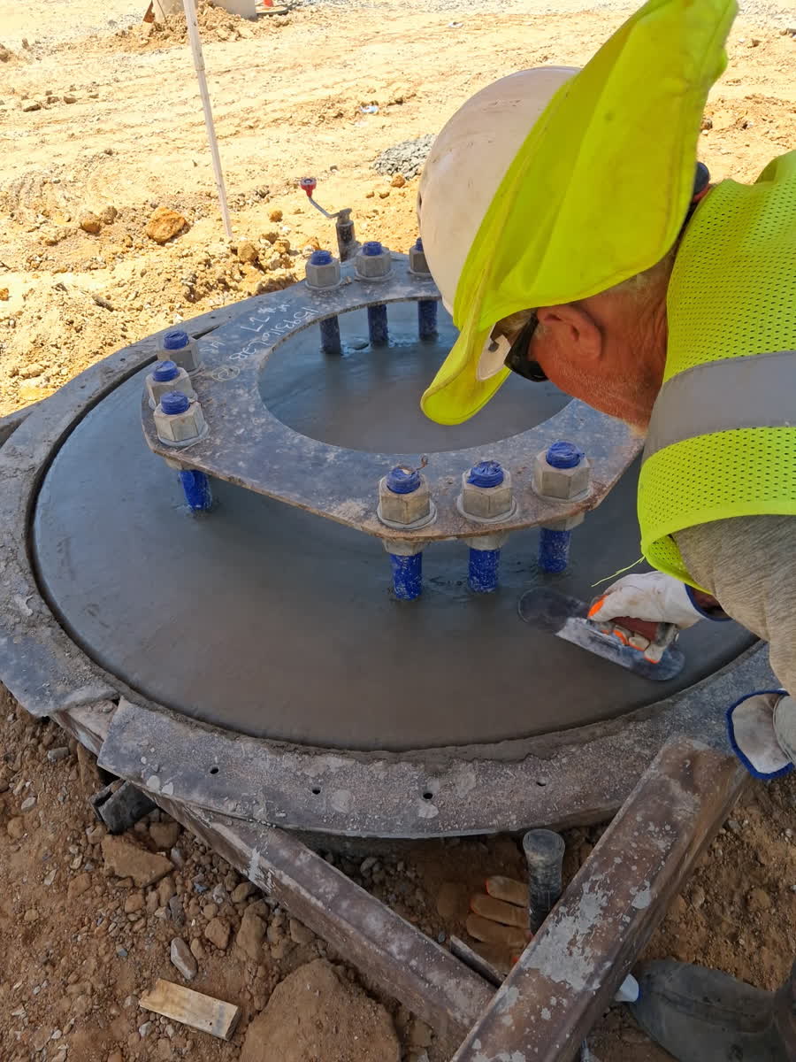 Finishing concrete around an anchor bolt template