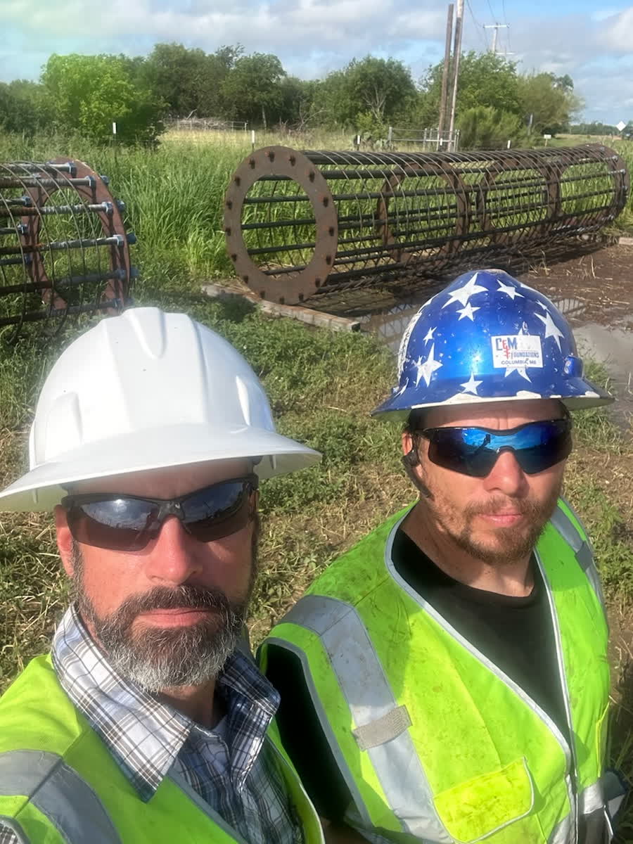 Two C & M Foundations crew members on a job site