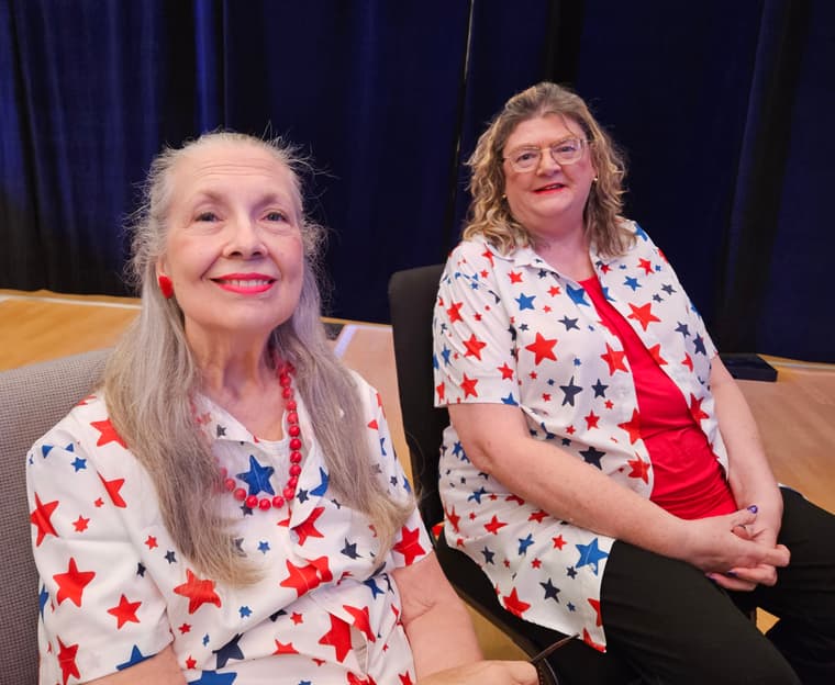 Two members sitting together before a show