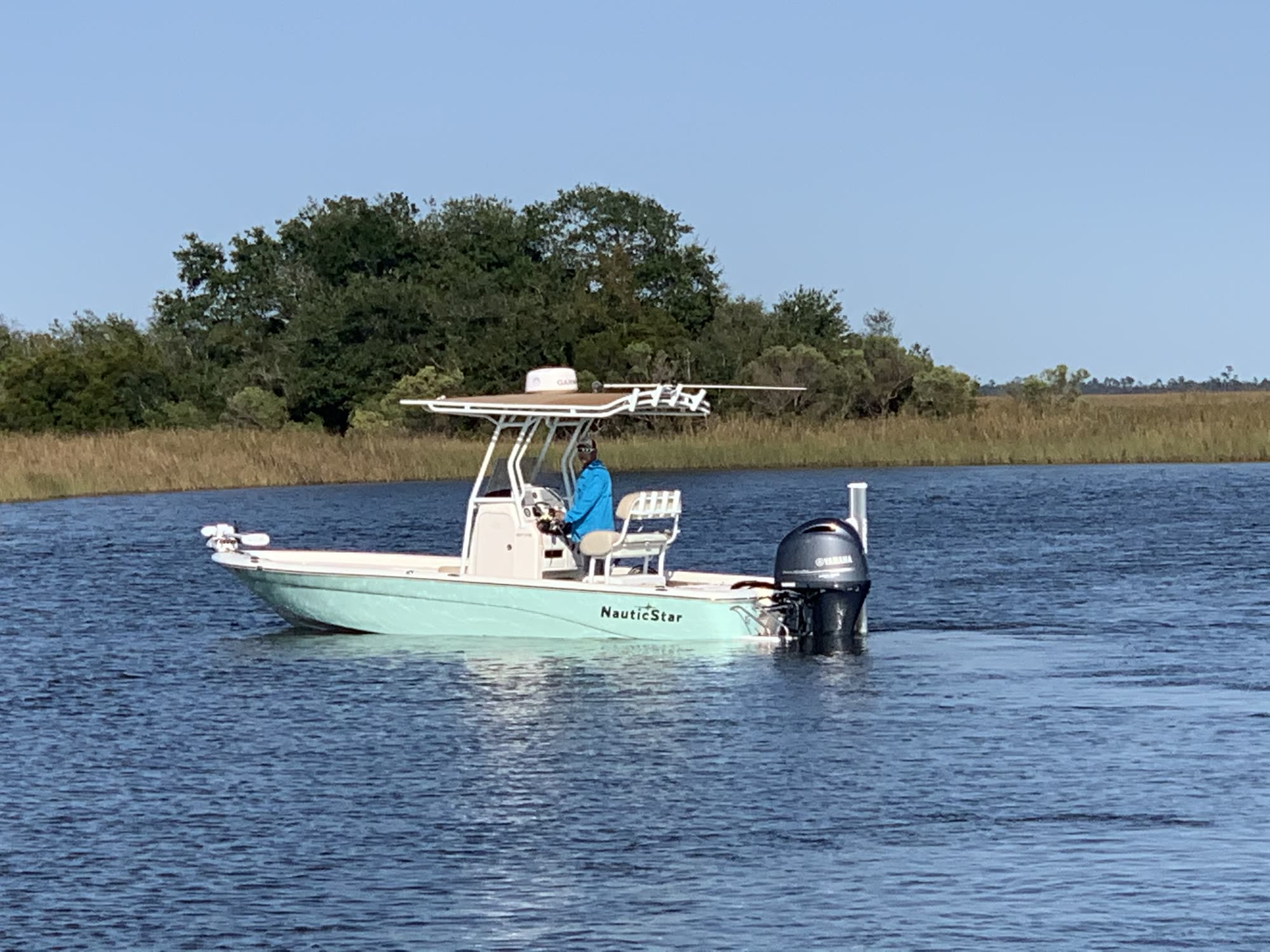 The Difference Maker, a NauticStar 227XTS bay boat, idling on the marsh