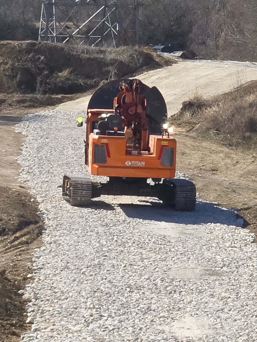 Drill rig travelling a gravel access road