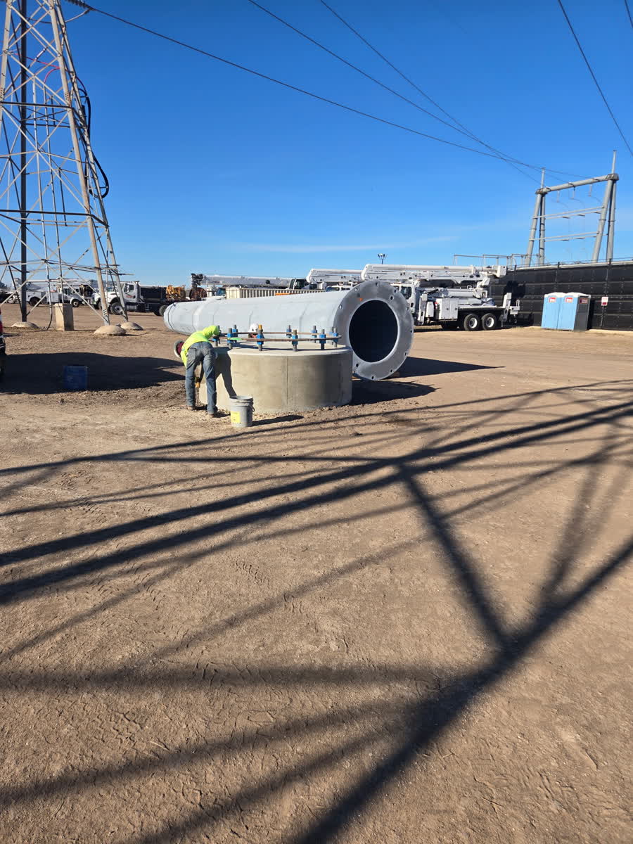Steel casing handled at a substation site