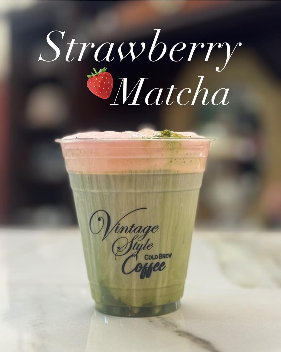 A strawberry matcha layered over ice in a clear cup