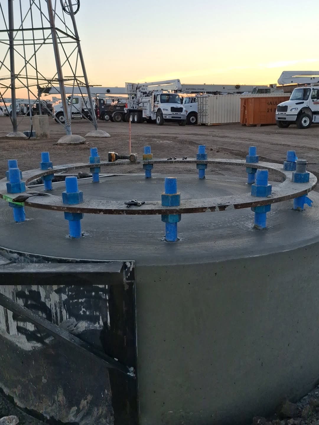 Finished caisson with anchor bolts at dusk