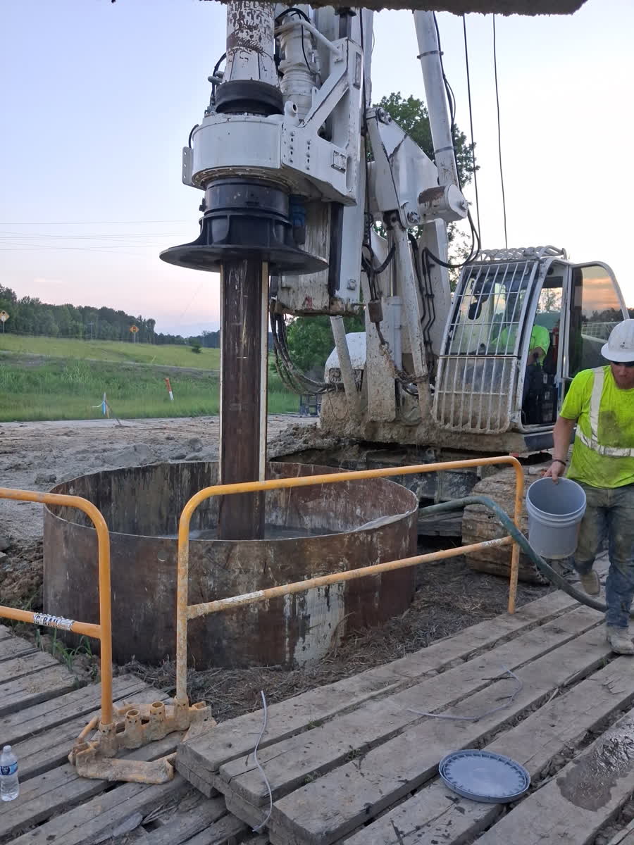 Drill rig on site at dusk